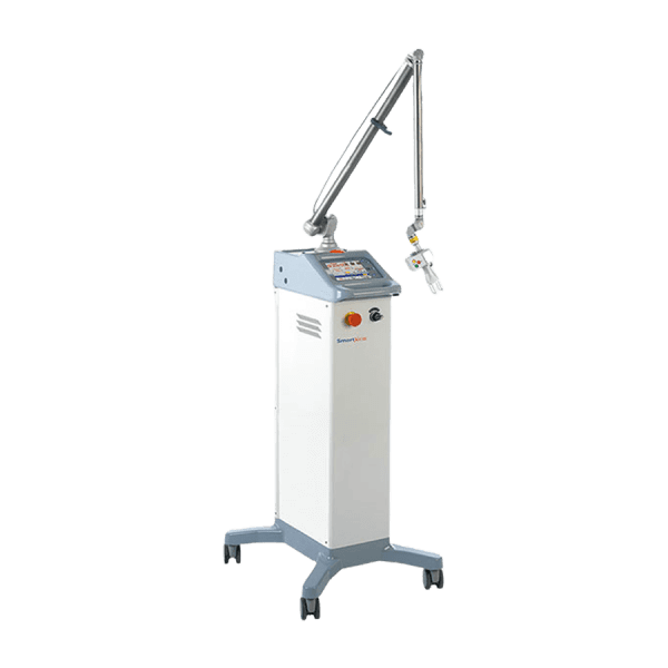 The Deka SmartXide DOT is a standing medical laser machine equipped with an articulated arm, control panel, and attached key. This used CO2 laser for sale is mounted on a wheeled base for easy movement.